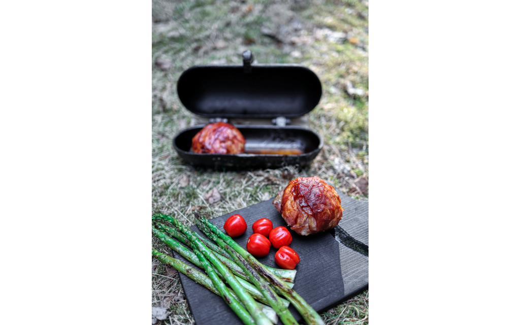Potetgryte i støpejern for bål og grill Petromax brukt på grill